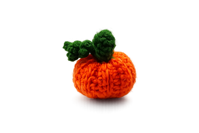 Orange crochet pumpkin keyring with a green stalk and curly leaf