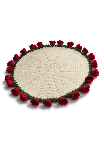 Round cream crochet mat edged with small red roses and green leaves