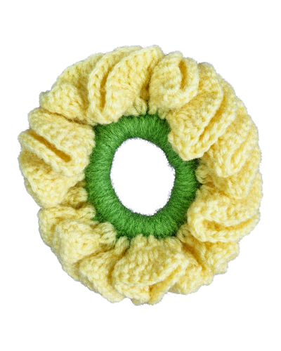 Pale yellow hand-crocheted scrunchie with a ruffled texture and a green inner band