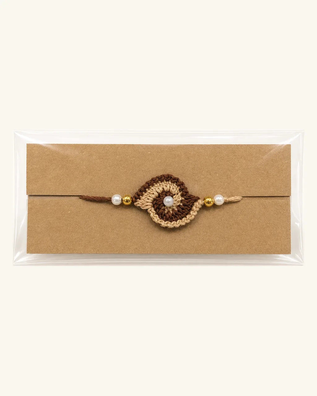 Brown Swirl Crochet Rakhi in its gift sleeve