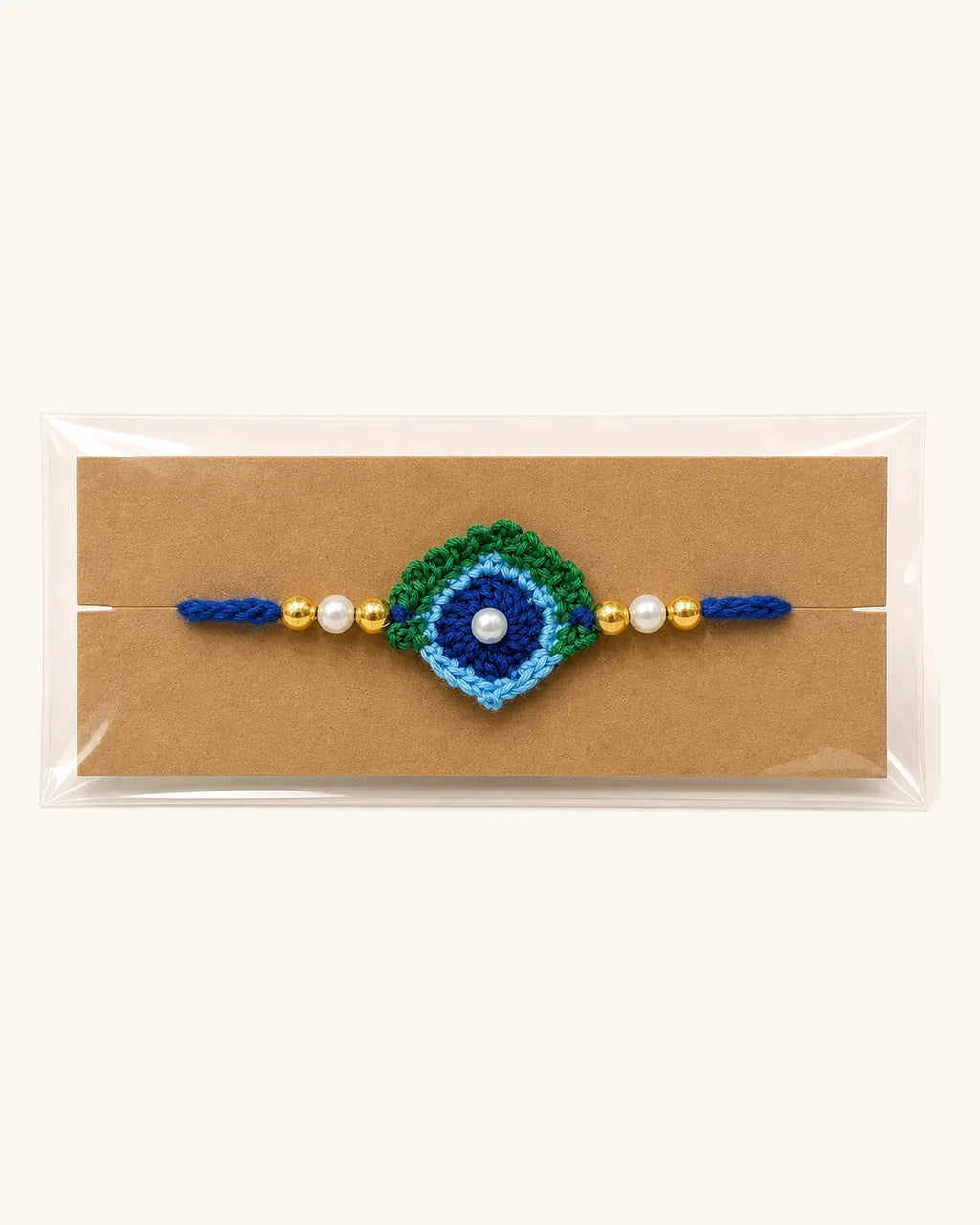 Morpankh Crochet Rakhi in its gift sleeve