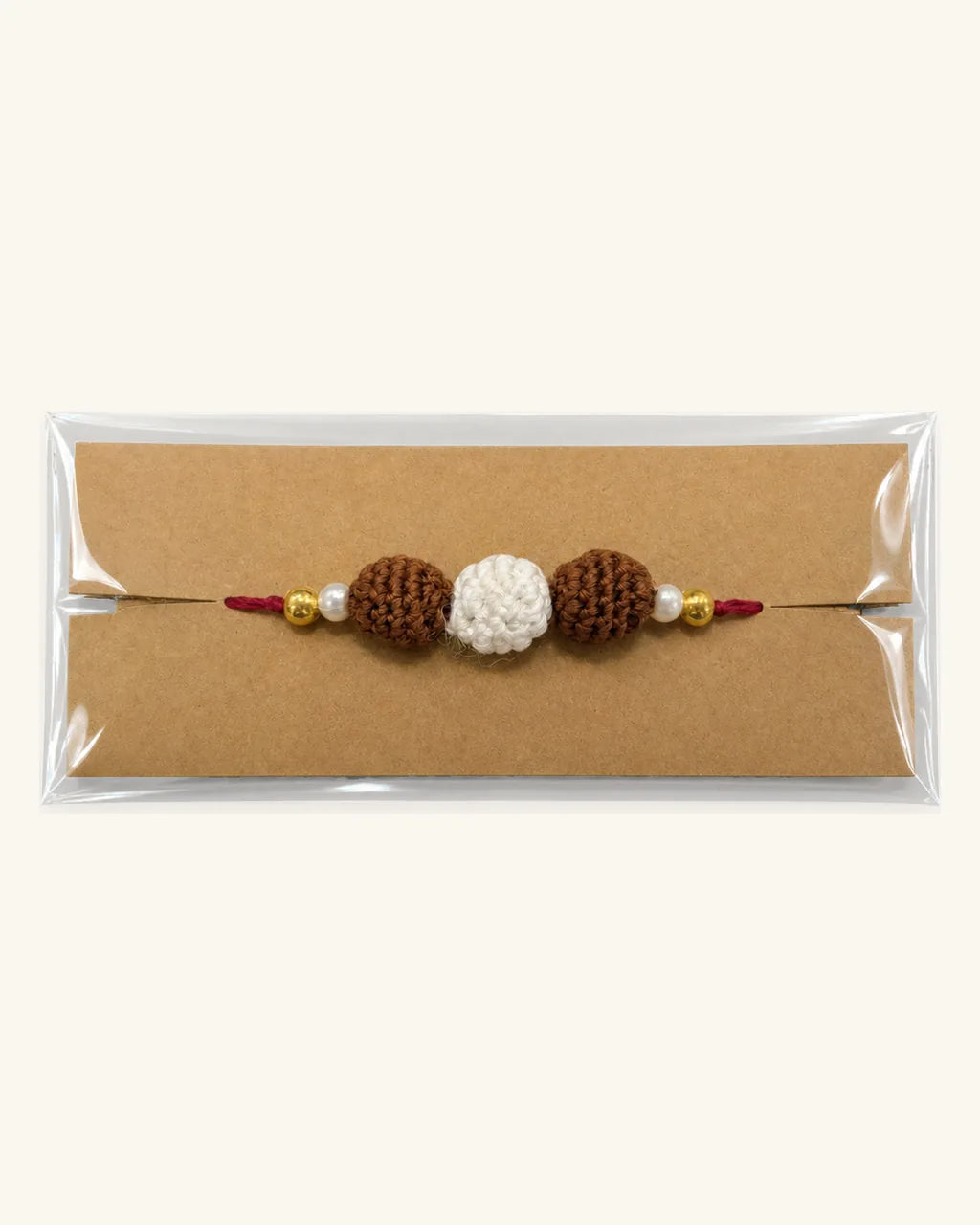 Double Rudraksh Crochet Rakhi in its gift sleeve