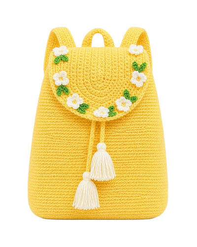 Yellow crochet backpack with a ring of white daisies on the flap and two cream tassels, front view